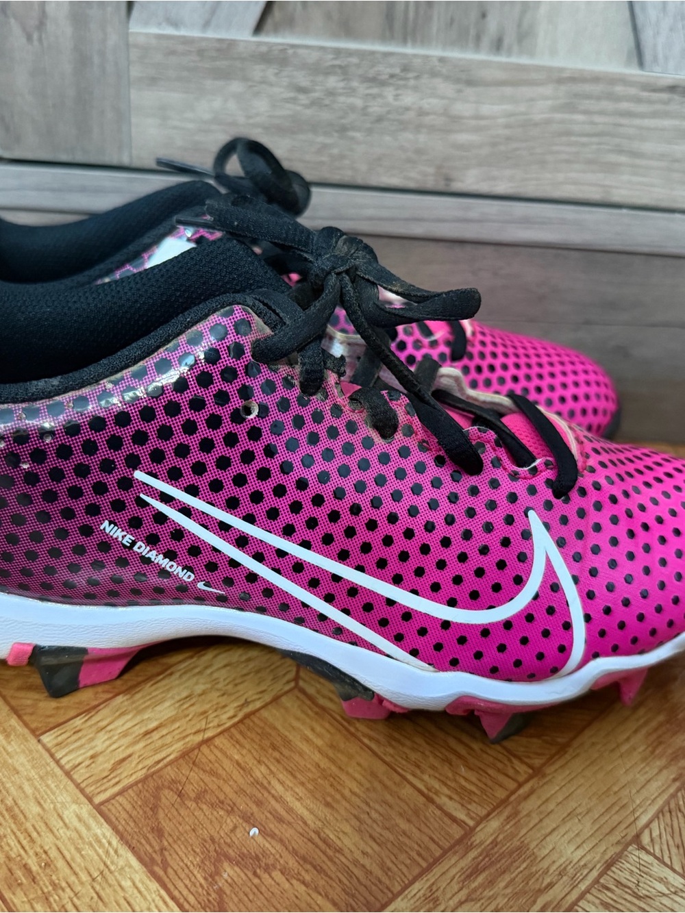 Nike Kids Pink and Black Cleats with White Swoosh